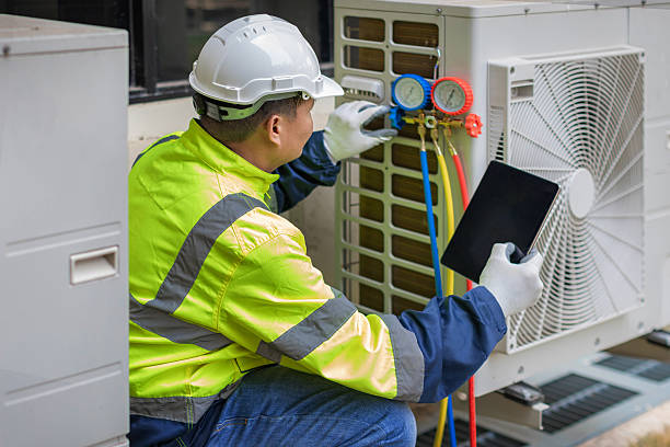 Professional Heat Pump Repair technician working in Paris, AR